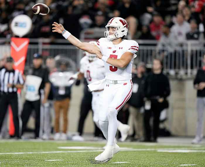Wisconsin quarterback Graham Mertz throwing the football against Ohio State.